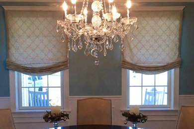 Large classic enclosed dining room in Boston with blue walls.