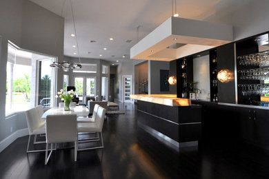 Inspiration for a large modern dark wood floor great room remodel in Miami with gray walls