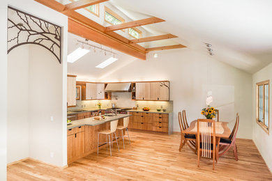 Trendy medium tone wood floor kitchen/dining room combo photo in Sacramento with white walls