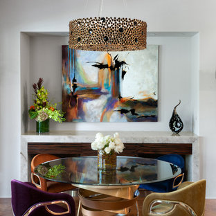 Example of a trendy medium tone wood floor and brown floor dining room design in Los Angeles with white walls