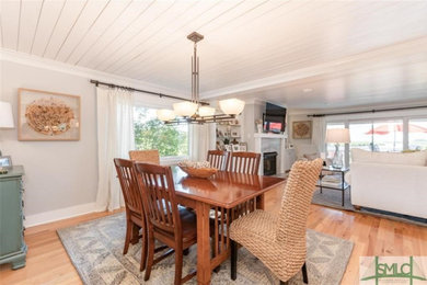 Dining room - coastal dining room idea in Other