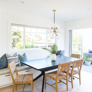 Inspiration for a coastal light wood floor and beige floor kitchen/dining room combo remodel in Orange County with white walls