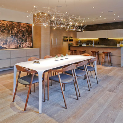 Large trendy light wood floor kitchen/dining room combo photo in Vancouver with white walls and no fireplace