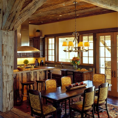 Kitchen/dining room combo - rustic dark wood floor kitchen/dining room combo idea in Other with yellow walls