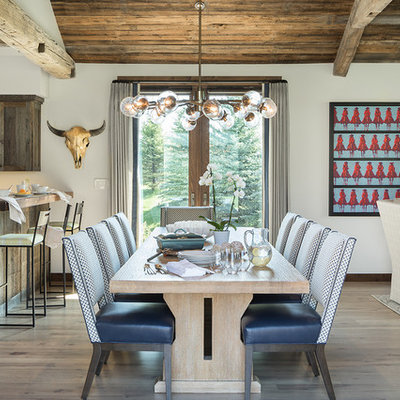 Mountain style light wood floor and beige floor great room photo in Other with white walls