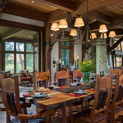 Dining room - rustic dark wood floor dining room idea in Other with white walls