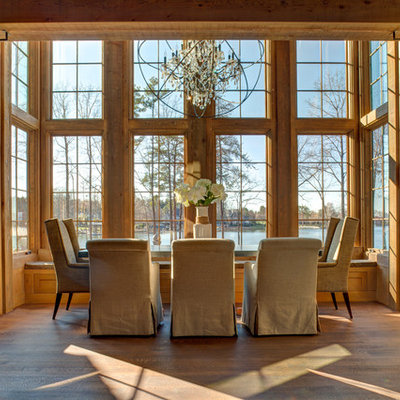 Great room - large rustic medium tone wood floor great room idea in Charlotte with brown walls