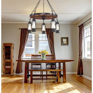 Example of a mid-sized mountain style light wood floor dining room design in New York with beige walls