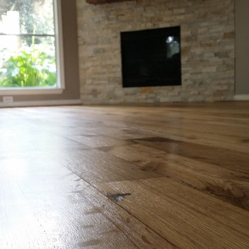 Rustic wood flooring repaired then refinished