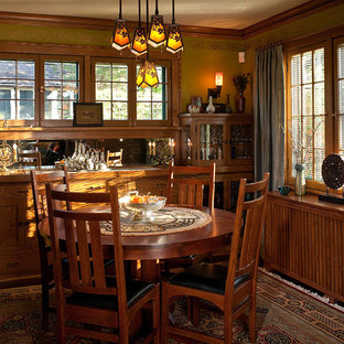 Inspiration for a craftsman dark wood floor enclosed dining room remodel in Minneapolis with no fireplace and brown walls