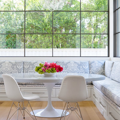 Inspiration for a mid-sized transitional light wood floor and brown floor kitchen/dining room combo remodel in Dallas with white walls and no fireplace