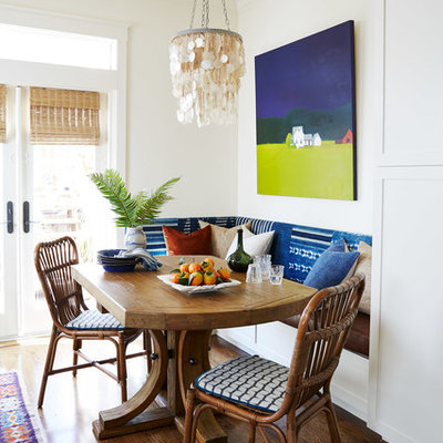Inspiration for a mid-sized coastal medium tone wood floor and brown floor kitchen/dining room combo remodel in San Francisco with white walls and no fireplace
