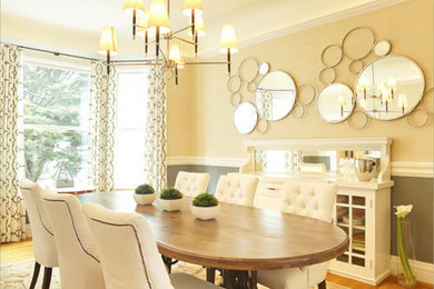 Example of a transitional medium tone wood floor dining room design in San Francisco with beige walls and no fireplace