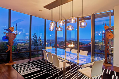 Inspiration for a large 1960s dark wood floor kitchen/dining room combo remodel in San Francisco with white walls and no fireplace