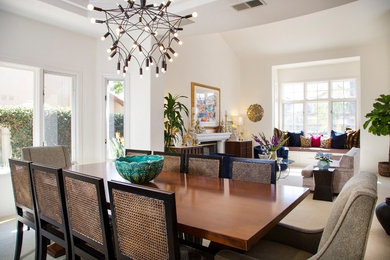 Inspiration for a mid-sized eclectic carpeted and white floor great room remodel in San Diego with white walls