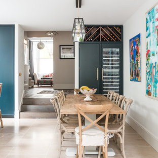 Design ideas for a large classic open plan dining room in London with beige floors and white walls.