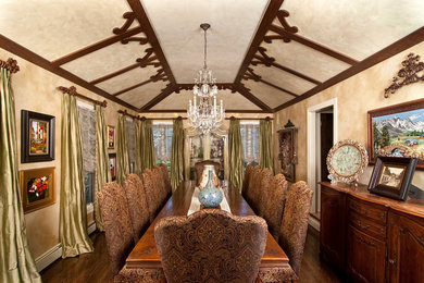 Enclosed dining room - traditional dark wood floor enclosed dining room idea in New York with beige walls