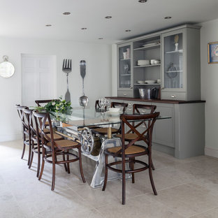 Inspiration for a medium sized traditional kitchen/dining room in Other with limestone flooring, grey floors and white walls.