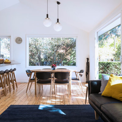 Dining room - small contemporary medium tone wood floor and brown floor dining room idea in Canberra - Queanbeyan with white walls