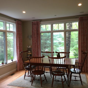 Soft Salmon-Colored Drapes Frame Open Dining Room