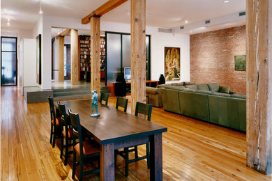 Example of a large trendy light wood floor great room design in New York with white walls