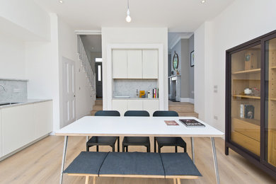 This is an example of a contemporary dining room in London.
