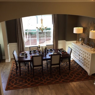 Mid-sized minimalist medium tone wood floor great room photo in Charleston with brown walls
