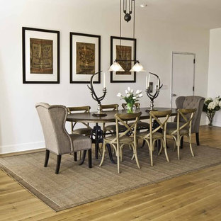 Inspiration for a large industrial medium tone wood floor great room remodel in New York with white walls