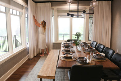 Huge danish medium tone wood floor and brown floor kitchen/dining room combo photo in Vancouver with gray walls