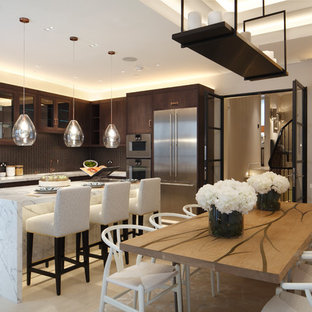 This is an example of a medium sized traditional kitchen/dining room in London with white walls and white floors.