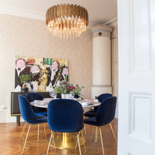 Design ideas for a contemporary dining room in London with beige walls, medium hardwood flooring and brown floors.