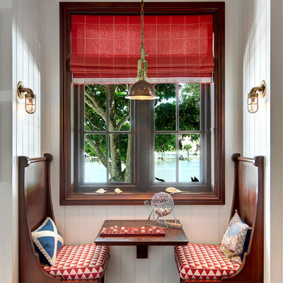 Example of a small beach style dark wood floor kitchen/dining room combo design in Miami with white walls