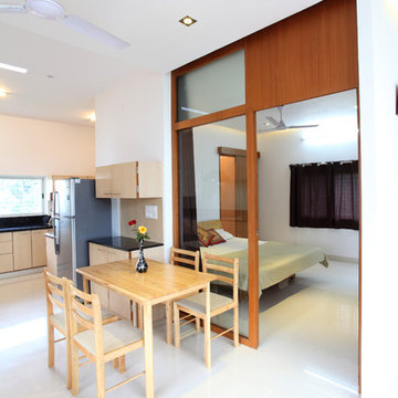 Studio apartment-Glass wall between the Bed room and the kitchen/dining to enhan