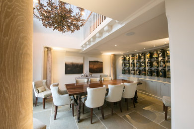 This is an example of a medium sized classic dining room in Other with white walls and grey floors.