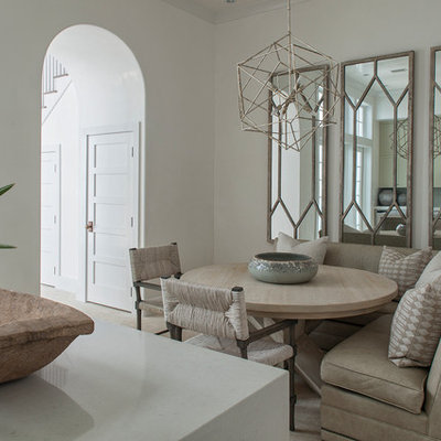 Example of a mid-sized transitional beige floor and travertine floor kitchen/dining room combo design in Nashville with white walls and no fireplace