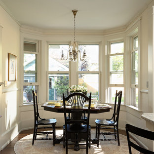 Mid-sized ornate dark wood floor kitchen/dining room combo photo in Minneapolis with white walls and no fireplace