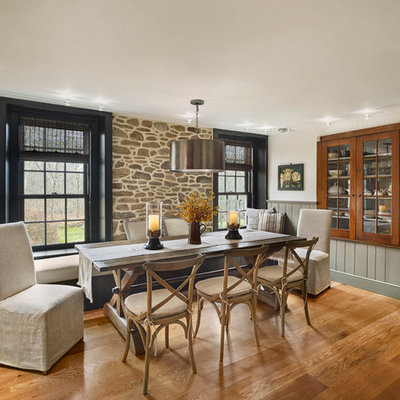 Large cottage medium tone wood floor kitchen/dining room combo photo in Philadelphia with white walls