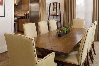 Inspiration for a timeless beige floor enclosed dining room remodel in Birmingham with white walls