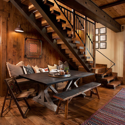 Inspiration for a rustic dark wood floor dining room remodel in Sacramento with beige walls