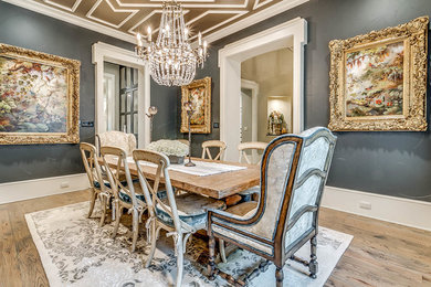 Inspiration for a large traditional enclosed dining room in Dallas with grey walls, medium hardwood flooring and no fireplace.
