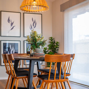 Contemporary separate dining room in Other with white walls, medium hardwood floors and brown floor.