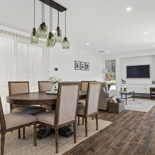 Inspiration for a transitional dining room in Perth with white walls and brown floor.
