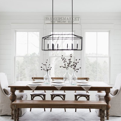 Example of a country light wood floor dining room design in Atlanta with white walls and no fireplace