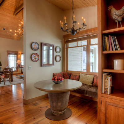 Inspiration for a mid-sized country dark wood floor and brown floor kitchen/dining room combo remodel in Seattle with beige walls and no fireplace