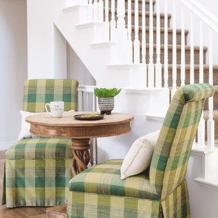 Example of a small trendy laminate floor and brown floor breakfast nook design in San Diego with white walls