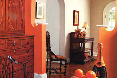 Eclectic dining room photo in Other with orange walls