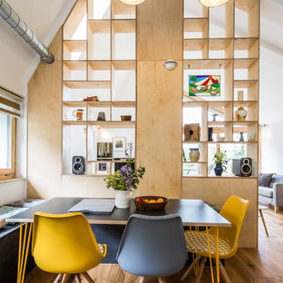 This is an example of a small contemporary open plan dining room in Other with medium hardwood flooring, brown floors and white walls.