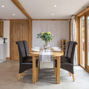 Design ideas for a country kitchen/dining room in Other with multi-coloured walls, no fireplace and beige floors.