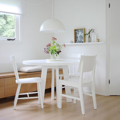 Inspiration for a scandinavian dining room remodel in Amsterdam with white walls