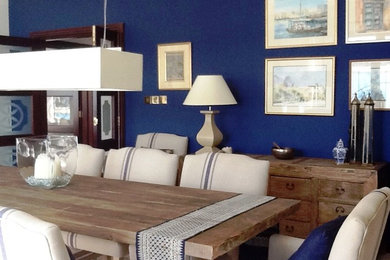Inspiration for an expansive nautical enclosed dining room in Other with blue walls and porcelain flooring.